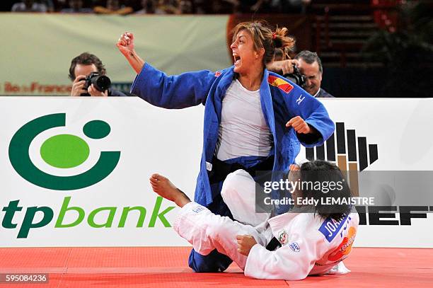 Ana Carrascoca of Spain celebrates her victory after winning her fight against Joana Ramos of Portugal during the women's under 52kg category bronze...