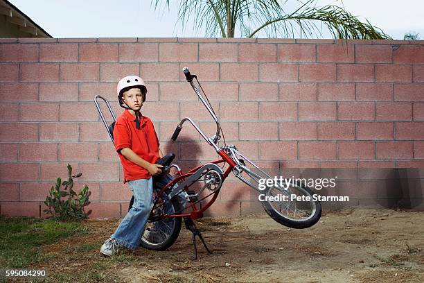 boy sitting on bicycle - only boys photos stockfoto's en -beelden