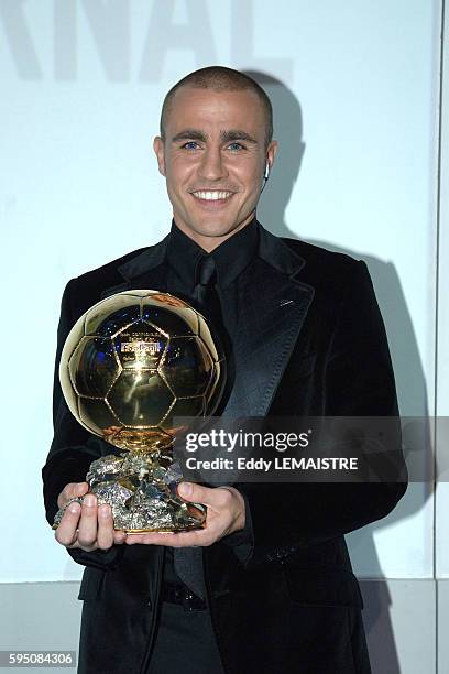 Italian soccer player of Real Madrid and captain of the Italian team that won the FIFA World Cup 2006 Fabio Cannavaro poses with the trophy of France...