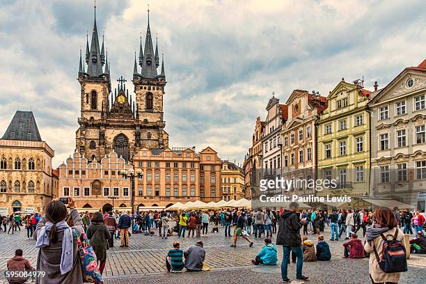 tourists at the old town square, prague - prague stock pictures, royalty-free photos & images