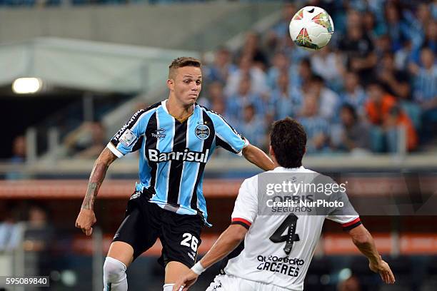 Luan and Marcos Caceres in the match between Gremio and Newell's, for the week 3 of the group 6 of the Copa Libertadores, played at the Arena do...