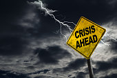 Crisis Ahead Sign With Stormy Background