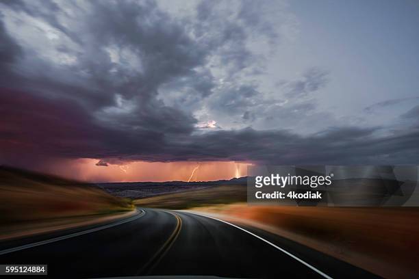 driving at sunset - rain road stock pictures, royalty-free photos & images