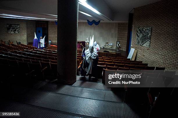 Nazarenes are prepared in assembly hall of the parish of Santa Gema in Santander before leaving in the evening procession of Prayer SANTANDER, Spain...