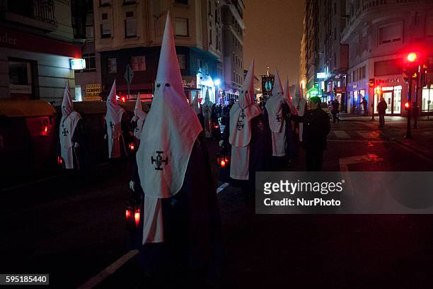 Nazarenes of nocturnal procession of prayer cross the main streets of the city of Santander SANTANDER, Spain on March 21, 2016. Santander Easter this...