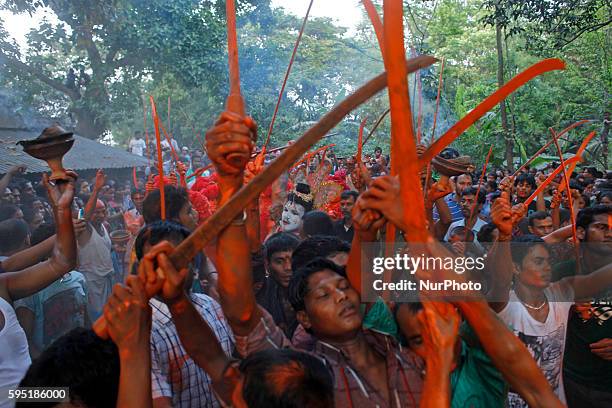 Last day of the bangle month the people of Munshiganj district Bangladesh do a warship of Hindu God Shiva praying for free from disease. In that day...