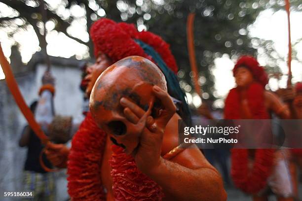 Last day of the bangle month the people of Munshiganj district Bangladesh do a warship of Hindu God Shiva praying for free from disease. In that day...