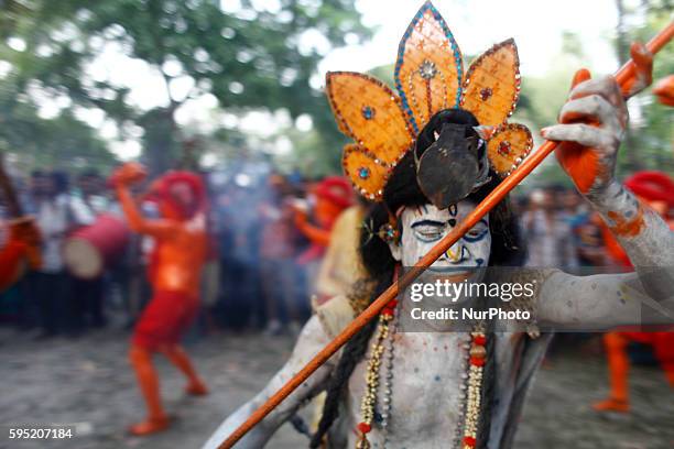 Last day of the bangle month the people of Munshiganj district Bangladesh do a warship of Hindu God Shiva praying for free from disease. In that day...