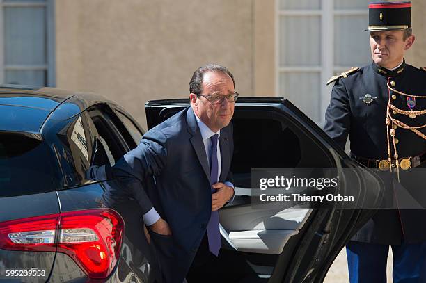 French president Francois Hollande, arrives in La Celle Saint Cloud, west of Paris during a meeting with European socio-democrats on August 25, 2016...