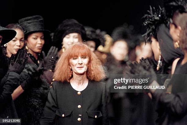 In this file picture taken on March 14, 1993 shows Sonia Rykiel applauded by her models at the 1993-94 autumn/winter collection in Paris. Sonia...