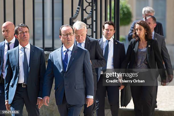 French Prime Minister Manuel Valls and French president Francois Hollande, arrive for ameeting with European Social Democrats on August 25, 2016 in...