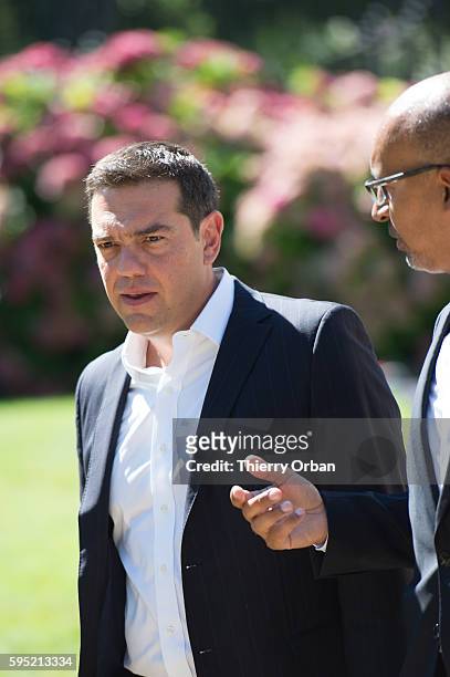 Greek Prime Minister Alexis Tsipras arrives for a meeting of European Social Democrats on August 25, 2016 in la Celle Saint Cloud.