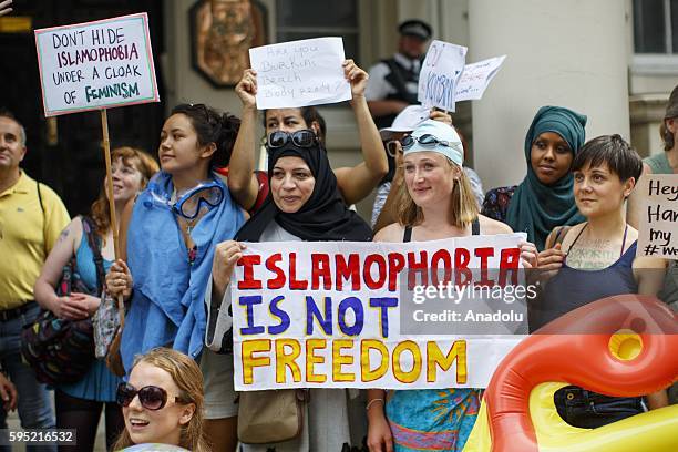 Protesters from different societies stage a demonstration named "Wear What You Want" themed as a beach party style, outside the French Embassy in...