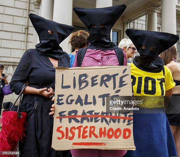 Protesters from different societies stage a demonstration named "Wear What You Want" themed as a beach party style, outside the French Embassy in...