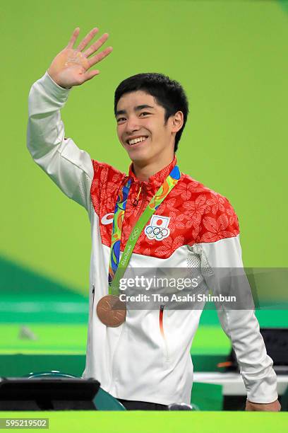 Men's Vault bronze medalist Kenzo Shirai of Japan waves after the medal ceremony for the Men's Vault on day 10 of the Rio 2016 Olympic Games at Rio...