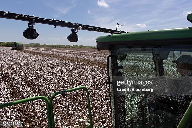 Farmer operates a John Deere & Co. Cotton picker at Legacy Farms in the Nueces County of Chapman Ranch, Texas, U.S., on Monday, Aug. 22, 2016. The...