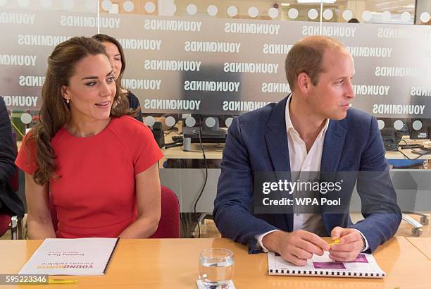 Catherine, Duchess of Cambridge and Prince William, Duke of Cambridge visit a helpline service run by one of the eight charity partners of Heads...