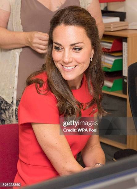 Catherine, Duchess of Cambridge visits a helpline service run by one of the eight charity partners of Heads Together on August 25, 2016 in London,...