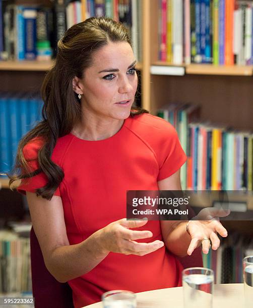 Catherine, Duchess of Cambridge visits a helpline service run by one of the eight charity partners of Heads Together on August 25, 2016 in London,...