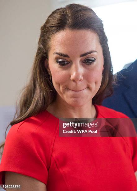 Catherine, Duchess of Cambridge visits a helpline service run by one of the eight charity partners of Heads Together on August 25, 2016 in London,...