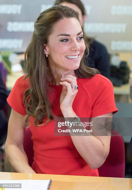 Catherine, Duchess of Cambridge visits a helpline service run by one of the eight charity partners of Heads Together on August 25, 2016 in London,...