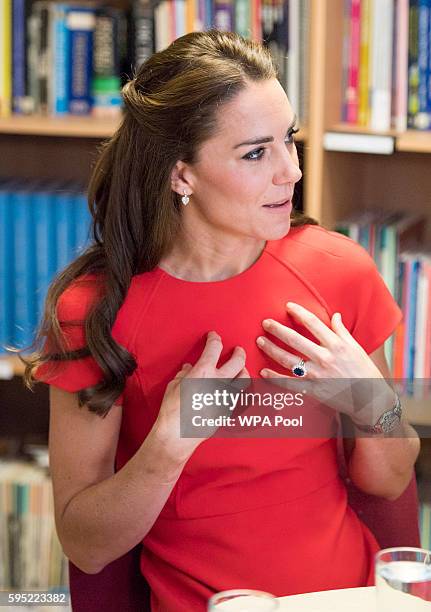 Catherine, Duchess of Cambridge visits a helpline service run by one of the eight charity partners of Heads Together on August 25, 2016 in London,...