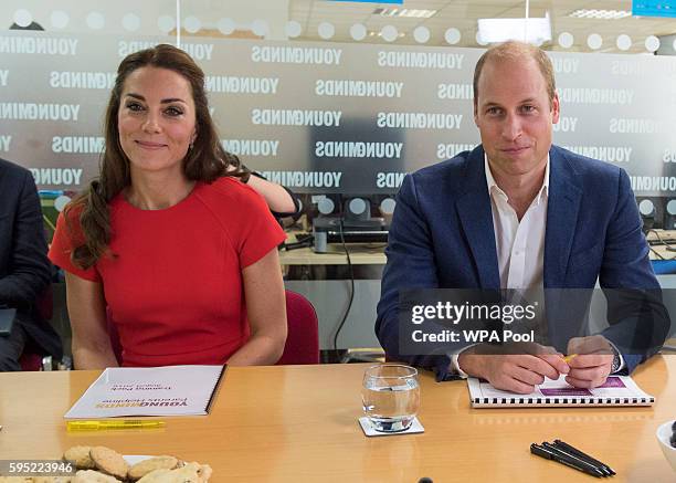 Catherine, Duchess of Cambridge and Prince William, Duke of Cambridge visit a helpline service run by one of the eight charity partners of Heads...