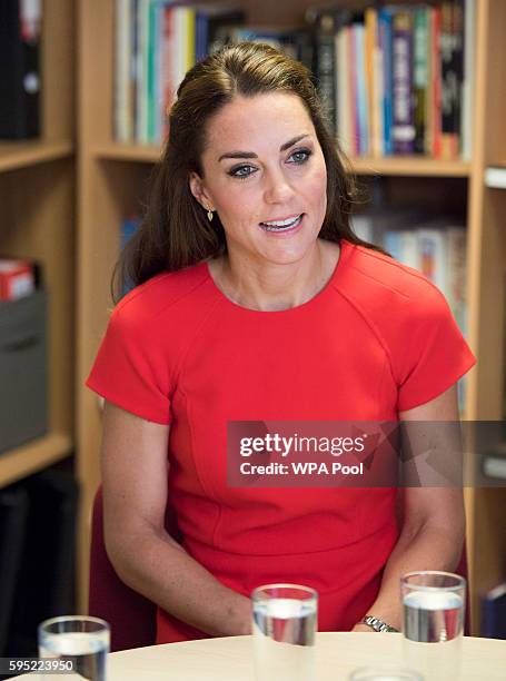 Catherine, Duchess of Cambridge visits a helpline service run by one of the eight charity partners of Heads Together on August 25, 2016 in London,...