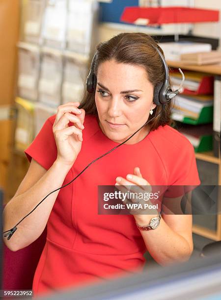 Catherine, Duchess of Cambridge visits a helpline service run by one of the eight charity partners of Heads Together on August 25, 2016 in London,...