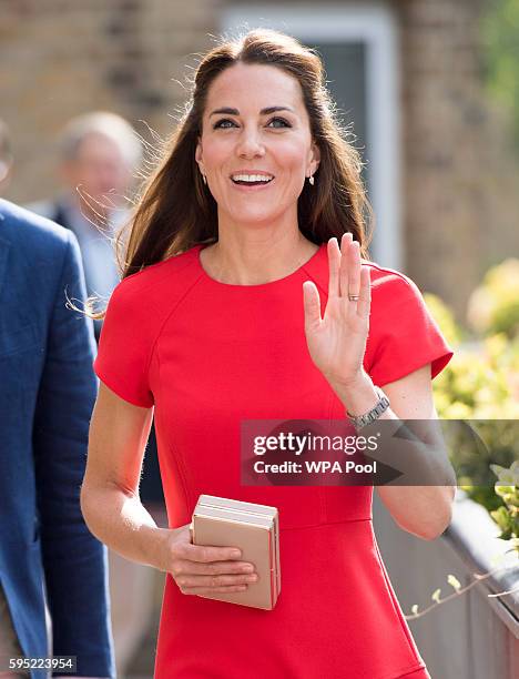 Catherine, Duchess of Cambridge visits a helpline service run by one of the eight charity partners of Heads Together on August 25, 2016 in London,...