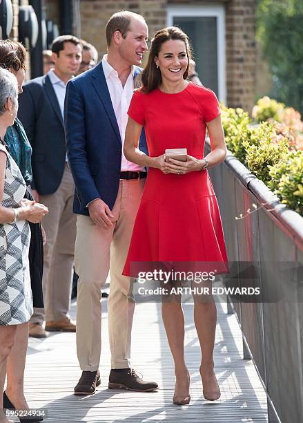 Britain's Catherine, Duchess of Cambridge and Prince William, Duke of Cambridge visit a mental health charity helpline operated by YoungMinds in...