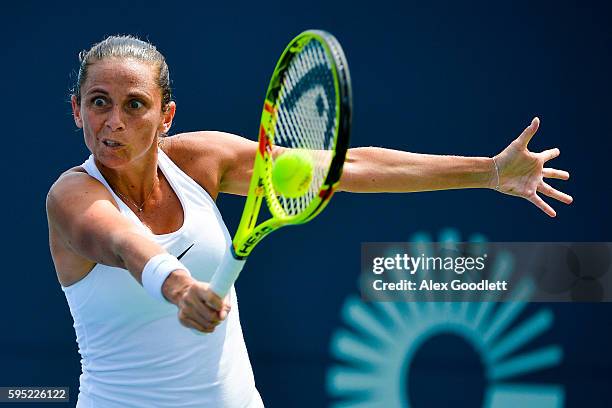 Roberta Vinci of Italy returns a shot during a match against Johanna Larsson of Sweden on day 5 of the Connecticut Open at the Connecticut Tennis...