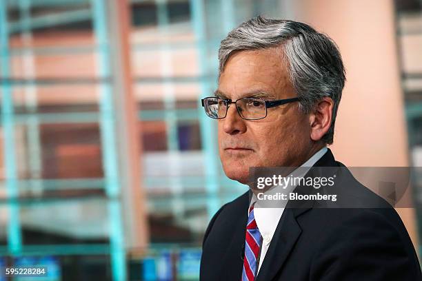 Ethan Harris, global head of research for Bank Of America Merrill Lynch, listens during a Bloomberg Television interview in New York, U.S., on...