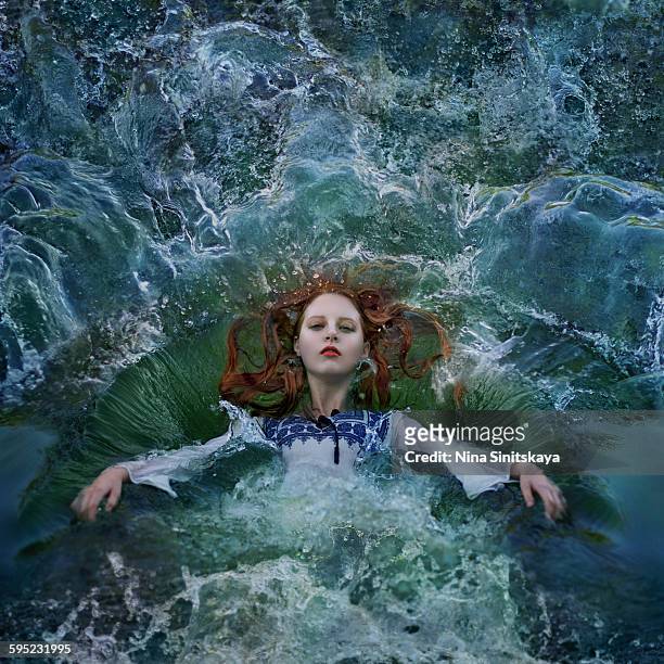 Red haired woman falling into water