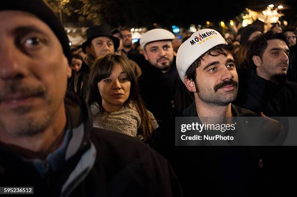 Palermo, March 31, 2014 - A young man is wearing a typical sicilan hat with the logo of the Five Star Movement. After being temporarily suspended...