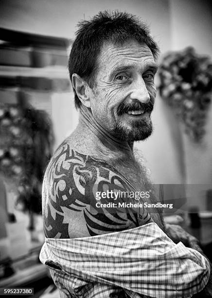December 13, 2012 - John McAfee Showing his tattoo at the Beacon Hotel where he is staying after arriving from Guatemala on December 13, 2012 in...