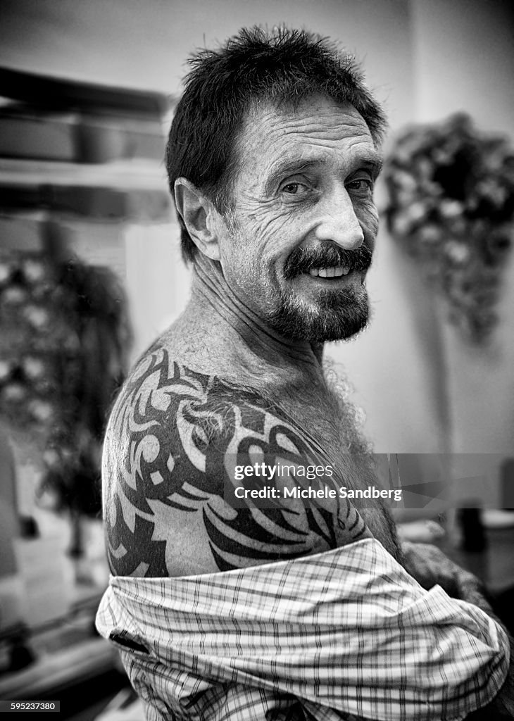 December 13, 2012 - Anti-Virus Software Magnate John McAfee Showing His Back Tattoo