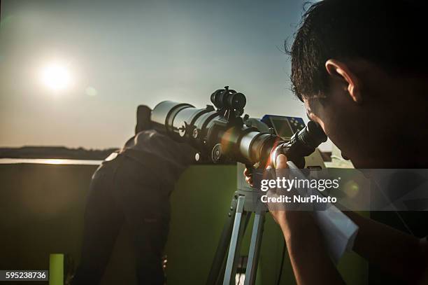 Student saw a Total Solar Eclipse through a telescope in Islamic Religious High School University, Pekalongan, Central Java, Indonesia, on March 9,...