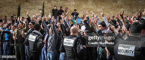 March 17, 2014 - Ramallah, West Bank, Palestinian Territory - Section of the large crowd assembles before being let inside of the Grand park Hotel in...