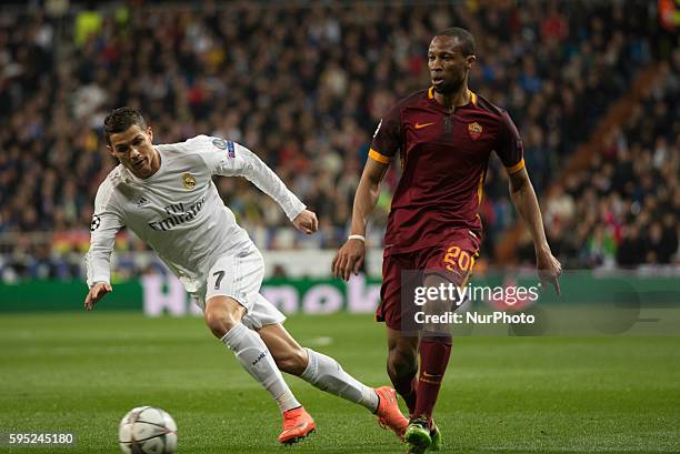 Real Madrids Portuguese Cristiano Ronaldo and Romas defense Keita in action during the Champions league football match Real Madrid CF vs Roma at the...