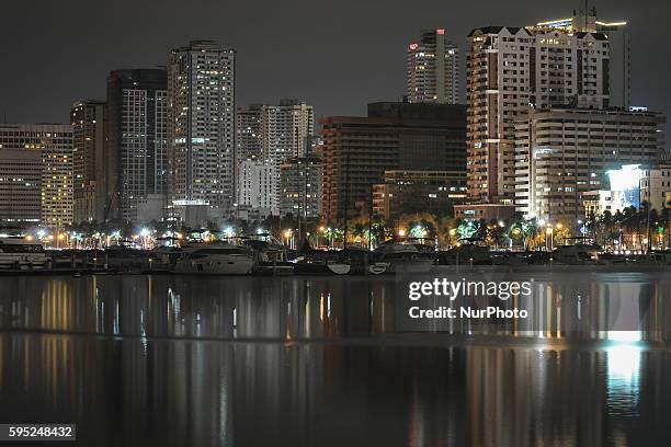 Photo of the Manila skyline taken at 8:12 PM local time, just before Earth Hour in Manila, Philippines, March 29, 2014. The Earth Hour Blue, a...