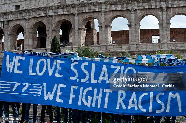"We Love S.S. Lazio 1900 - We Fight Racism". A group of Lazio fans staged a flash mob at the Colosseum on Thursday to show that not all supporters of...