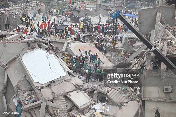 In this photograph taken on April 25 Rescue workers take part in the rescue operation on the top of the damaged building at Savar Several thousand...