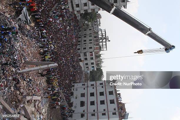 In this photograph taken on April 25 Rescue workers take part in the rescue operation on the top of the damaged building at Savar Several thousand...