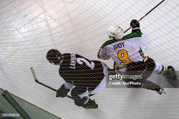 Marc Giot and Jamie Lawrence in the match between South Africa and New Zealand, corresponding to the third day of Group B of the World Ice Hockey...