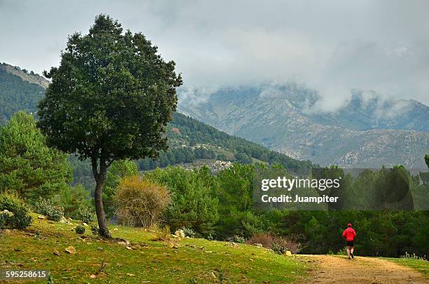 running in a landscape - juampiter fotografías e imágenes de stock