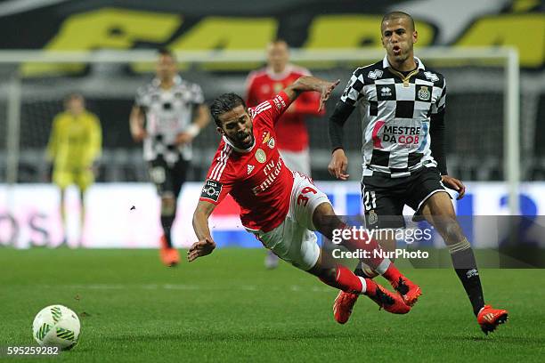 Benfica's Marooc midfielder Mehdi Carcela with Boavista's forward Tahar during the Premier League 2015/16 match between Boavista FC and SL Benfica,...