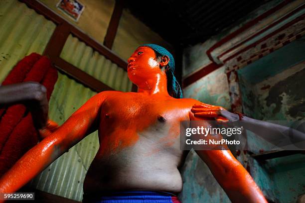 Last day of the bangle month the people of Munshiganj district Bangladesh do a warship of Hindu God Shiva praying for free from disease. In that day...