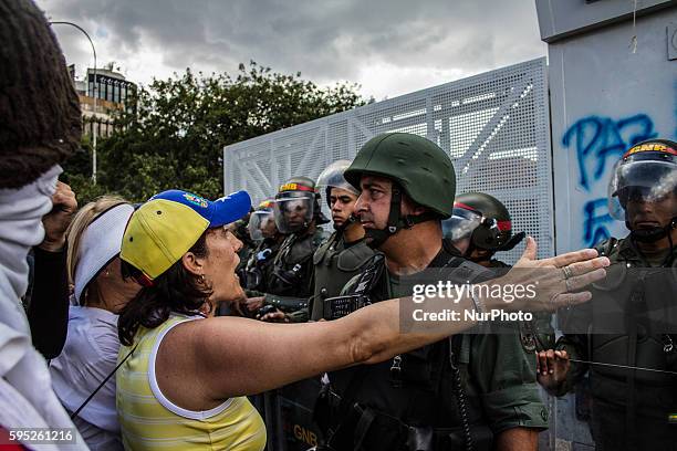 Thousands of Venezuelans marched to La Carlota Airbase in Caracas, on March 16, 2014 to express their disagreement with the meddling of the Cuba...