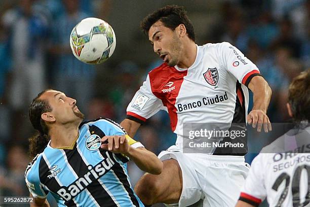 Hernan Barcos and Victor Lopez in the match between Gremio and Newell's, for the week 3 of the group 6 of the Copa Libertadores, played at the Arena...